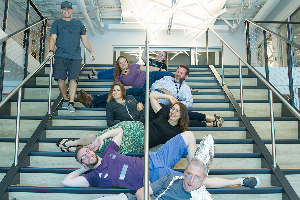 A StrongMind subgroup strikes a pose on the stairway during a break in the action.