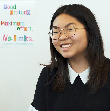 Young female student laughing in a classroom