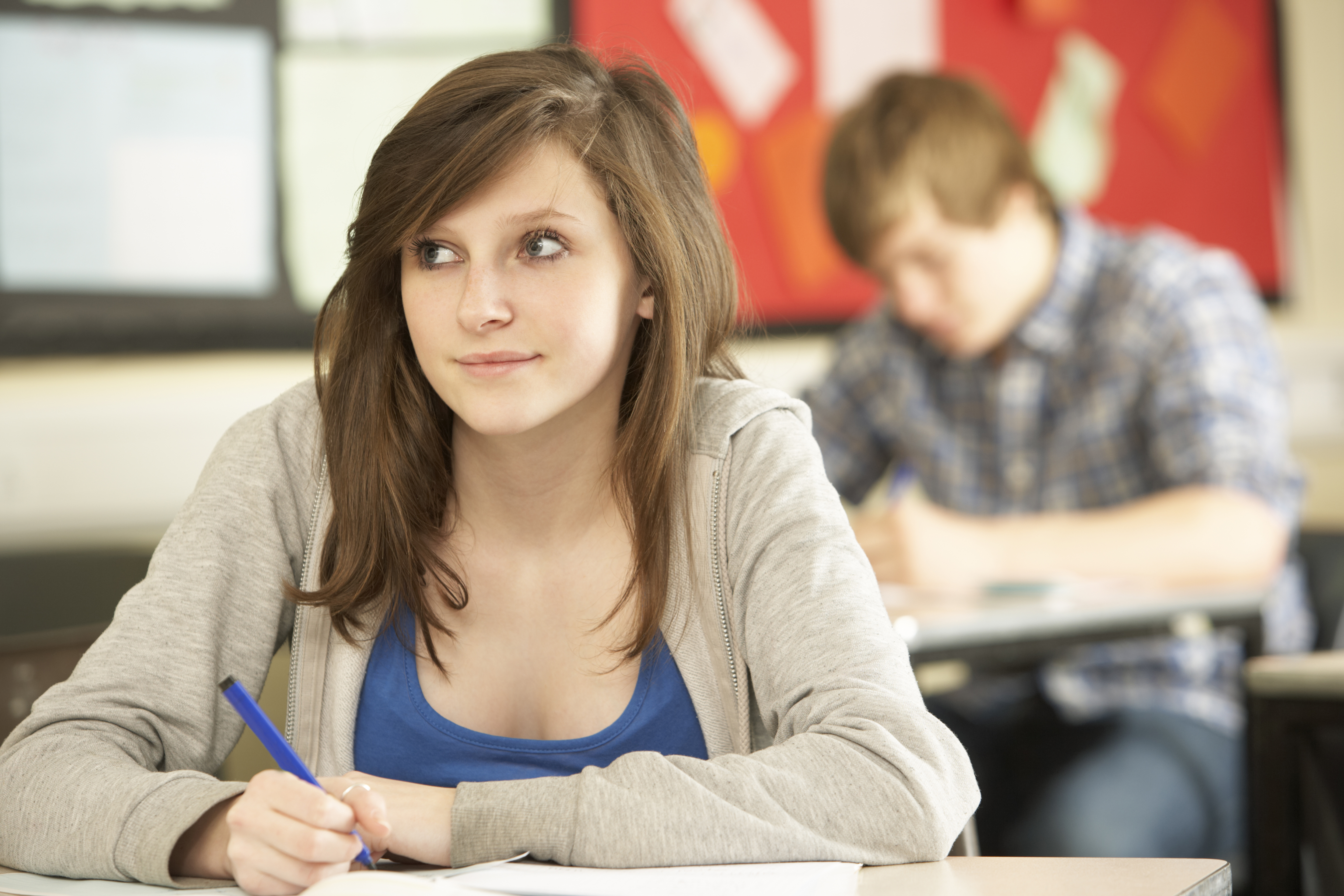 Female Teenage Student Studying In Classroom