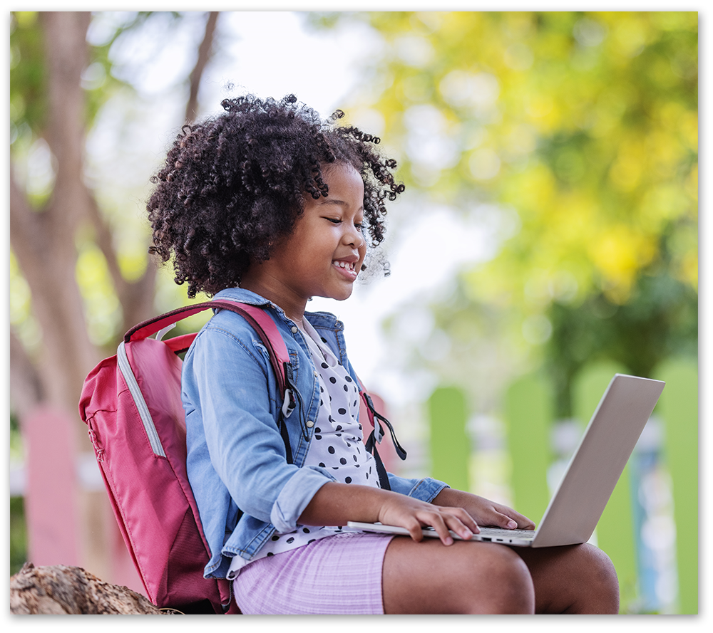 young child working on laptop