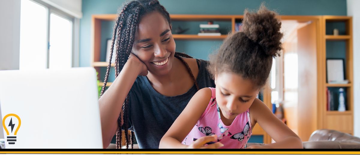 mother and daughter doing homework at a desk