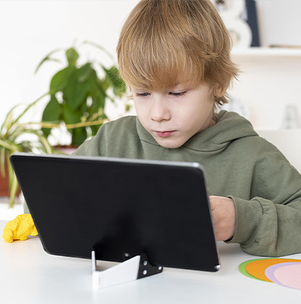 Boy learning on tablet