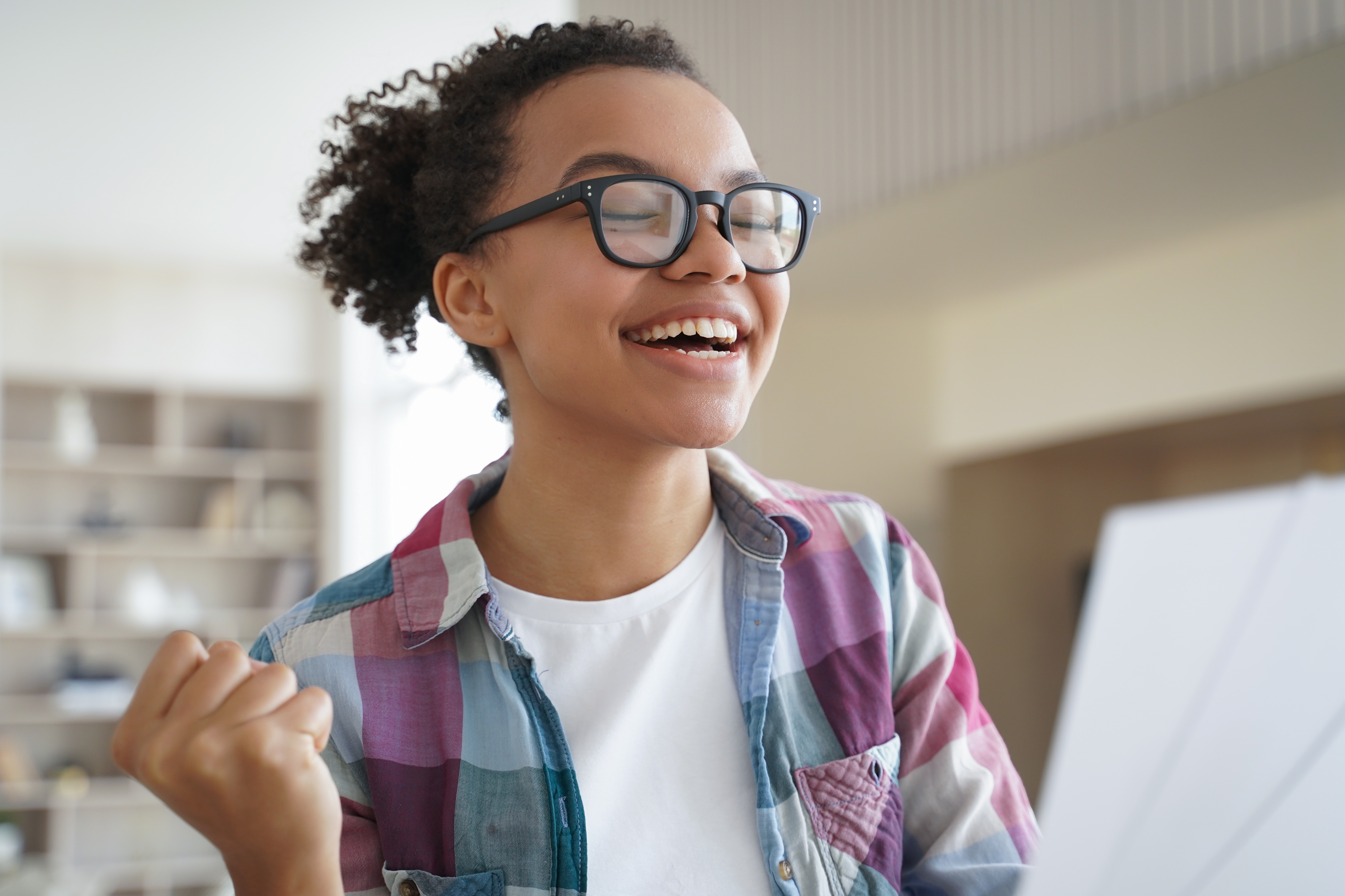 Excited teen girl receives good news