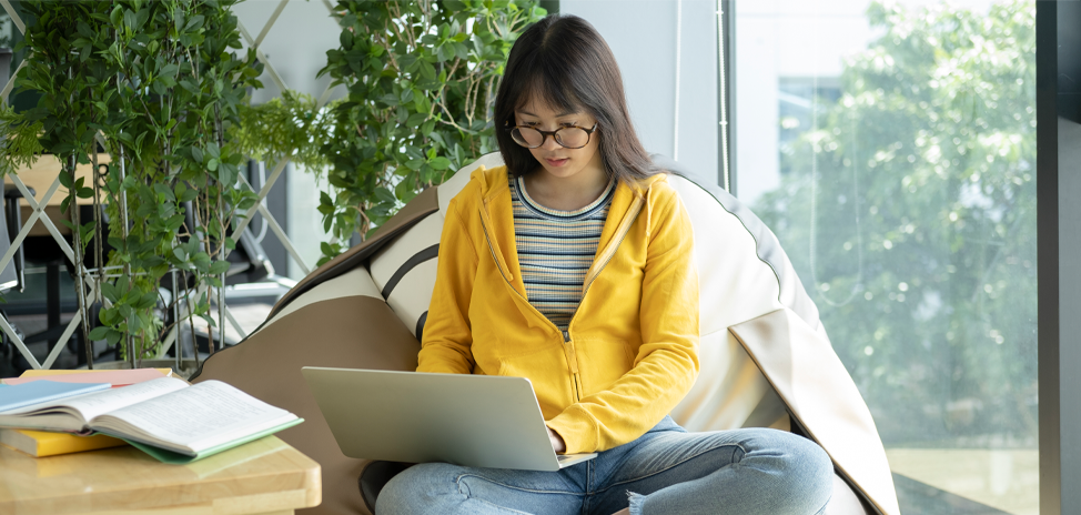 Girl on laptop studying for online school