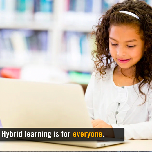 Young girl with brown hair and a white shirt completing school work on a laptop. The caption says "Hybrid learning is for everyone."